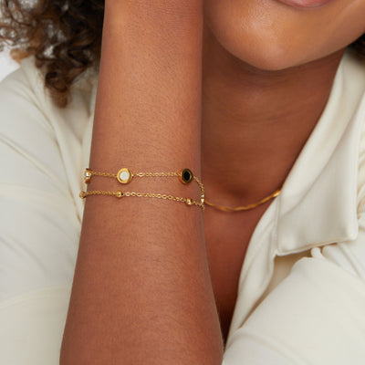 Bracelet en onyx et pierre blanche